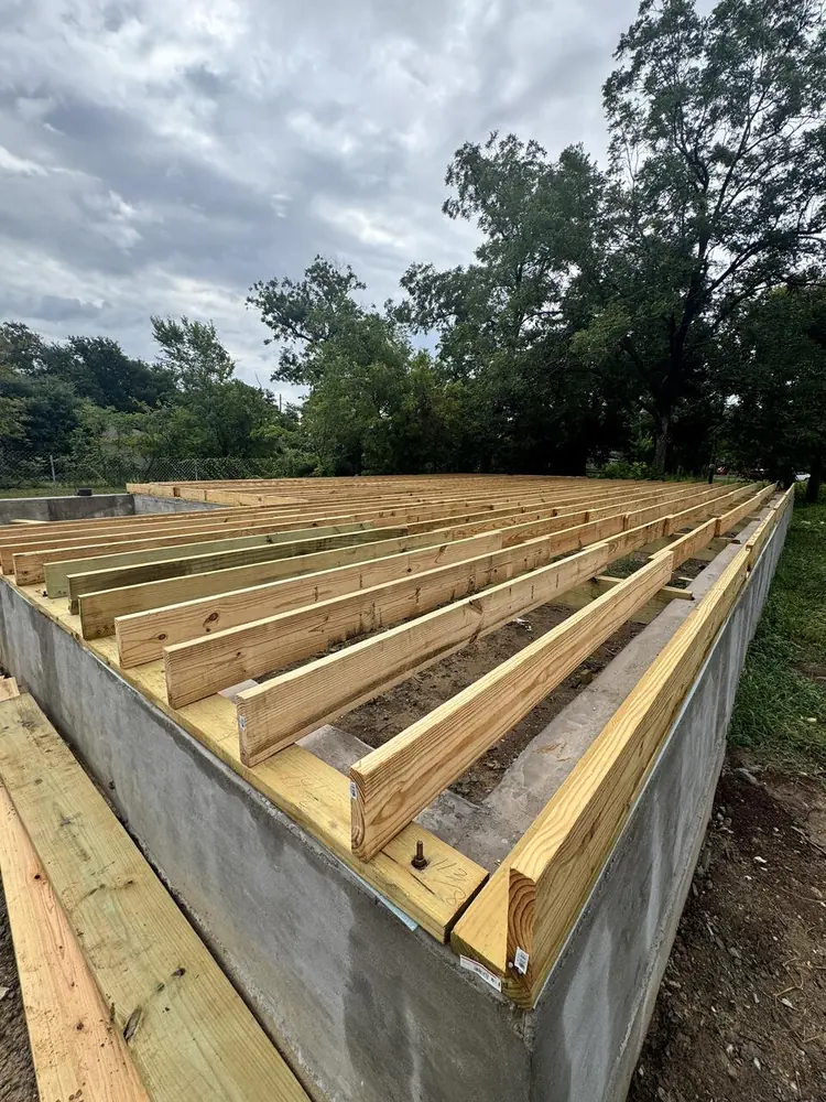 Floor framing over concrete stem wall foundation